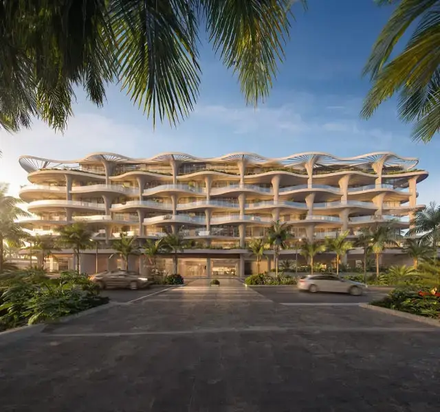 Mamsha Palm community exteriors with palm trees and coastal views