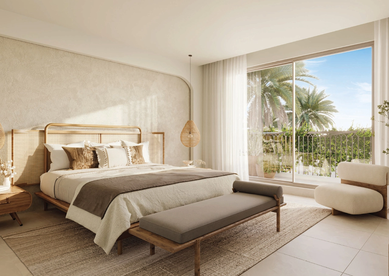 Living space with earth-toned décor and large patio doors