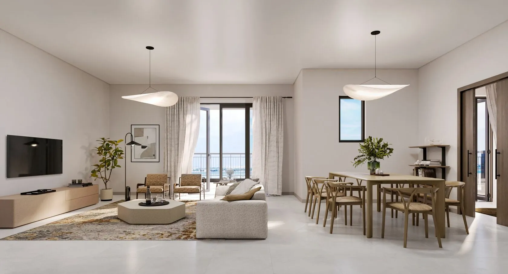 Kitchen island with integrated seating and pendant lights in Yas Golf Collection apartment