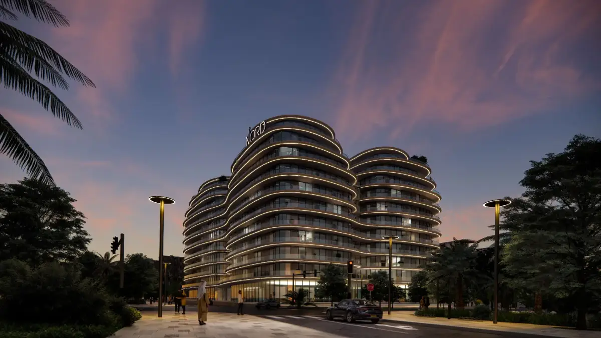 Sunset casting warm tones over Henge Residences' geometric structure