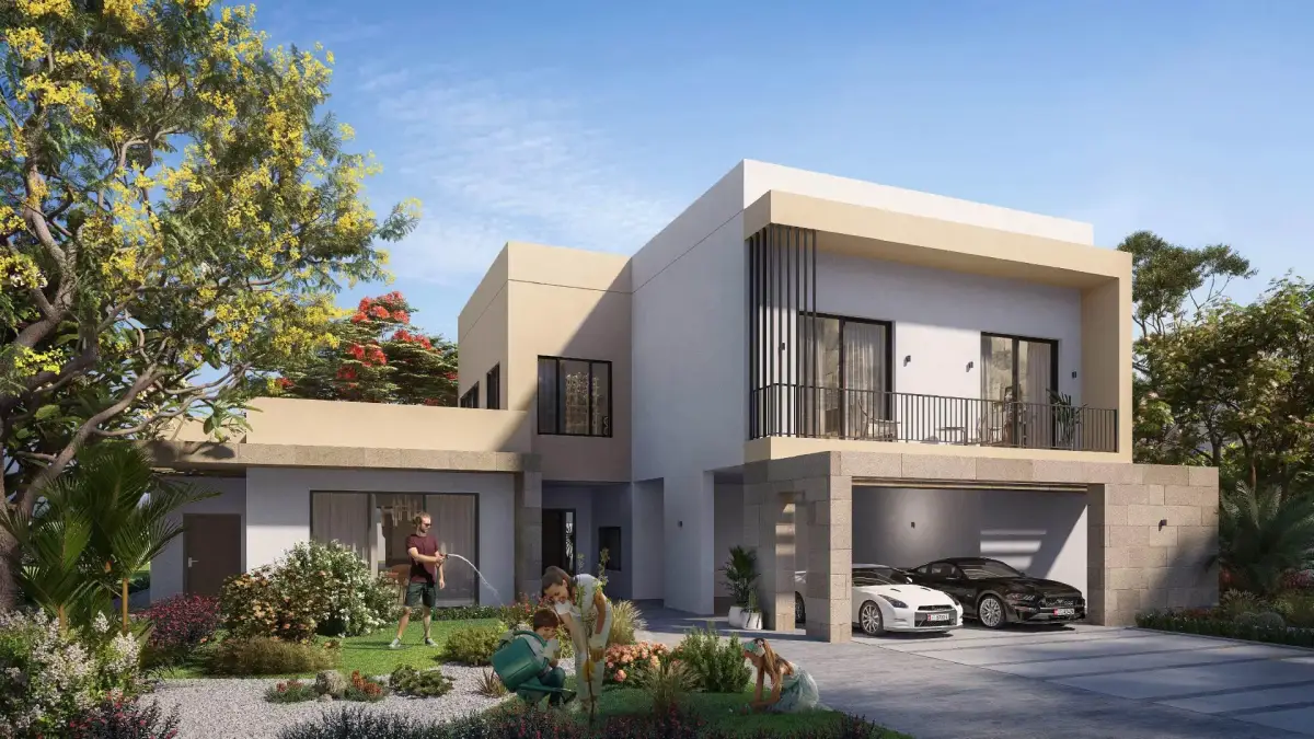 Gated entrance with manicured landscaping at The Dahlias community
